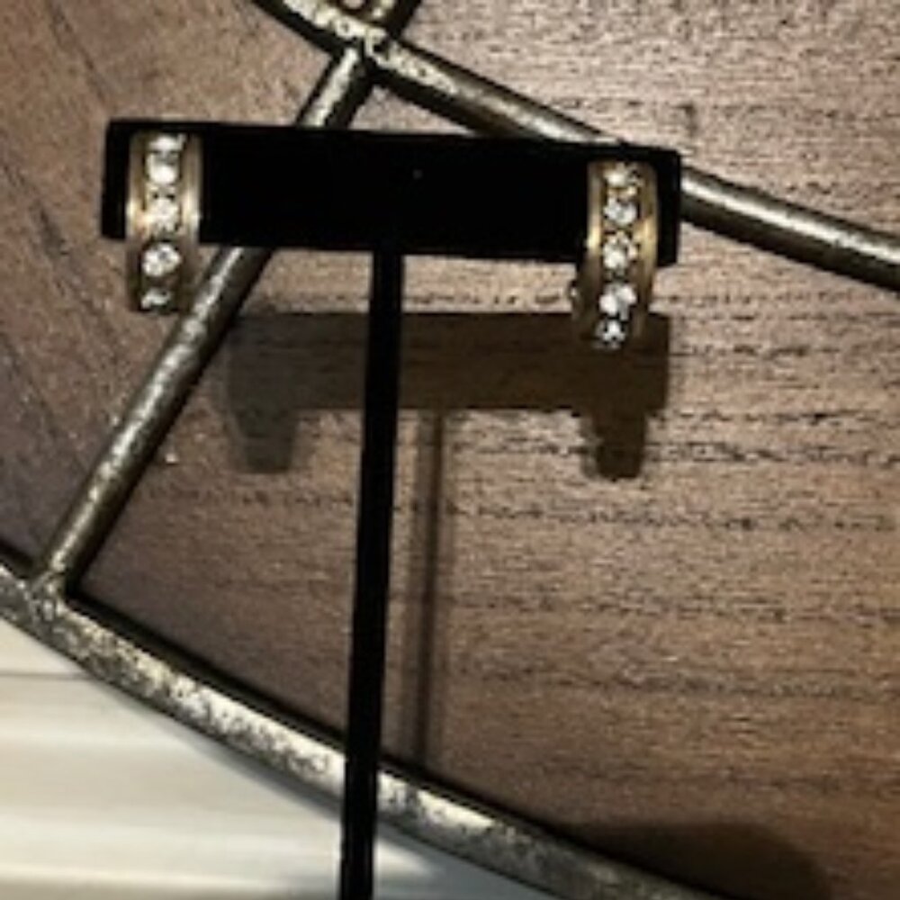 Vintage silver-toned metal clip-on hoop earrings with textured design